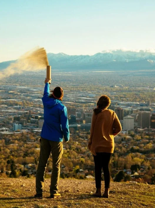 people spreading ashes from an urn