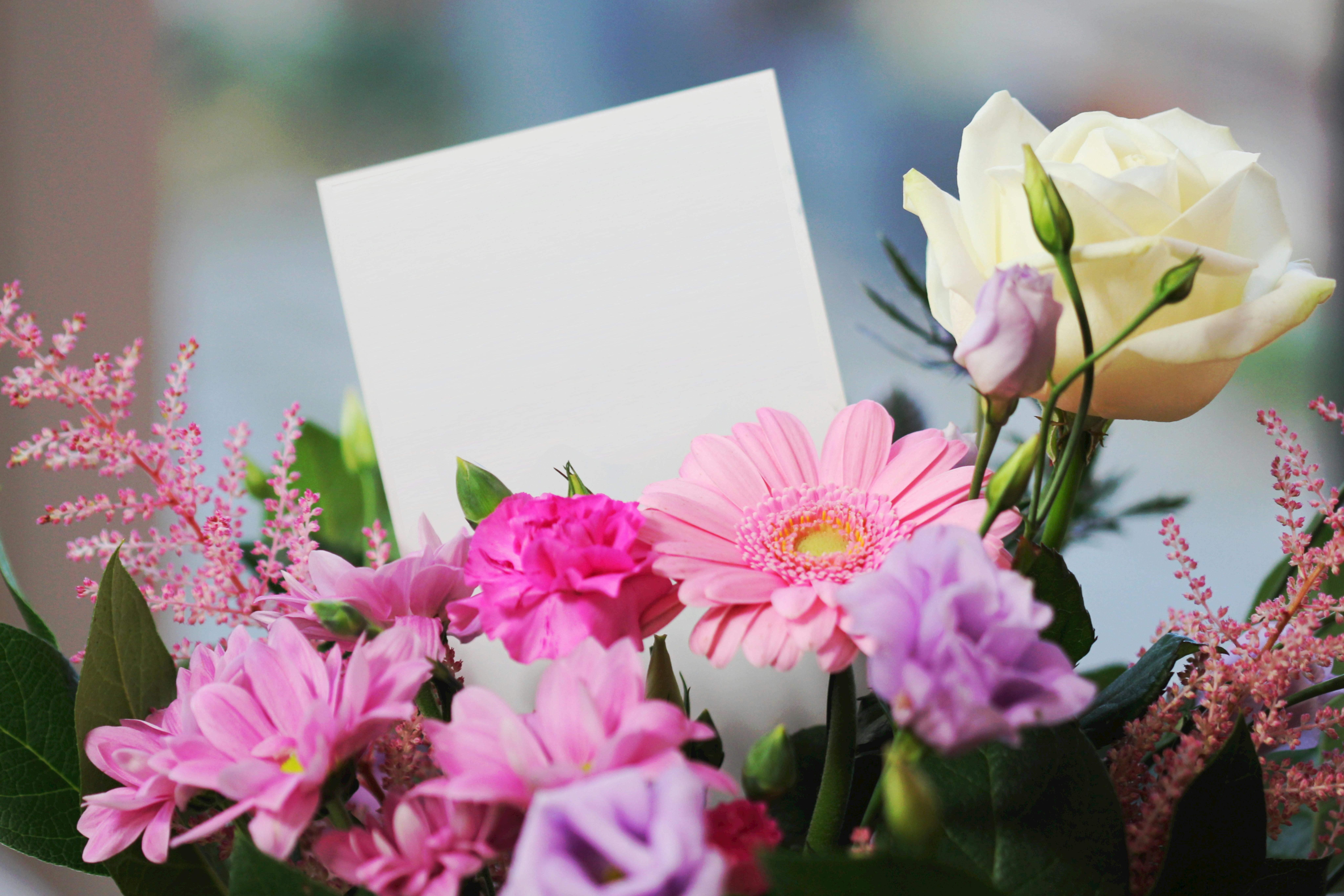 Funeral flowers with blank card for a mom