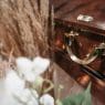 funeral casket with flowers on top