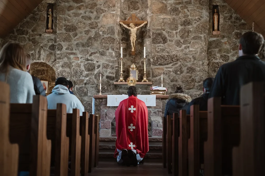 preist at alter in Catholic church