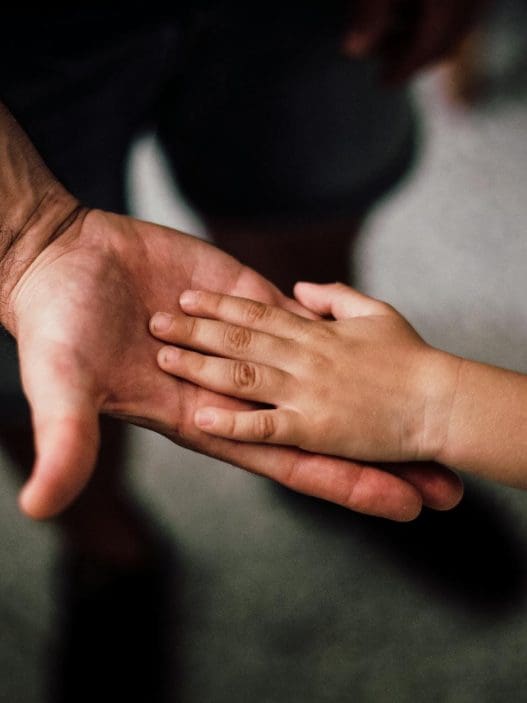 father and child s hands together