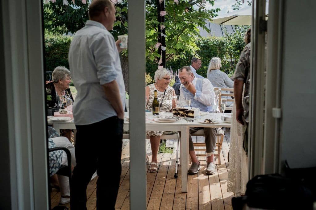 people gathering in garden for a memorial service on a budget.