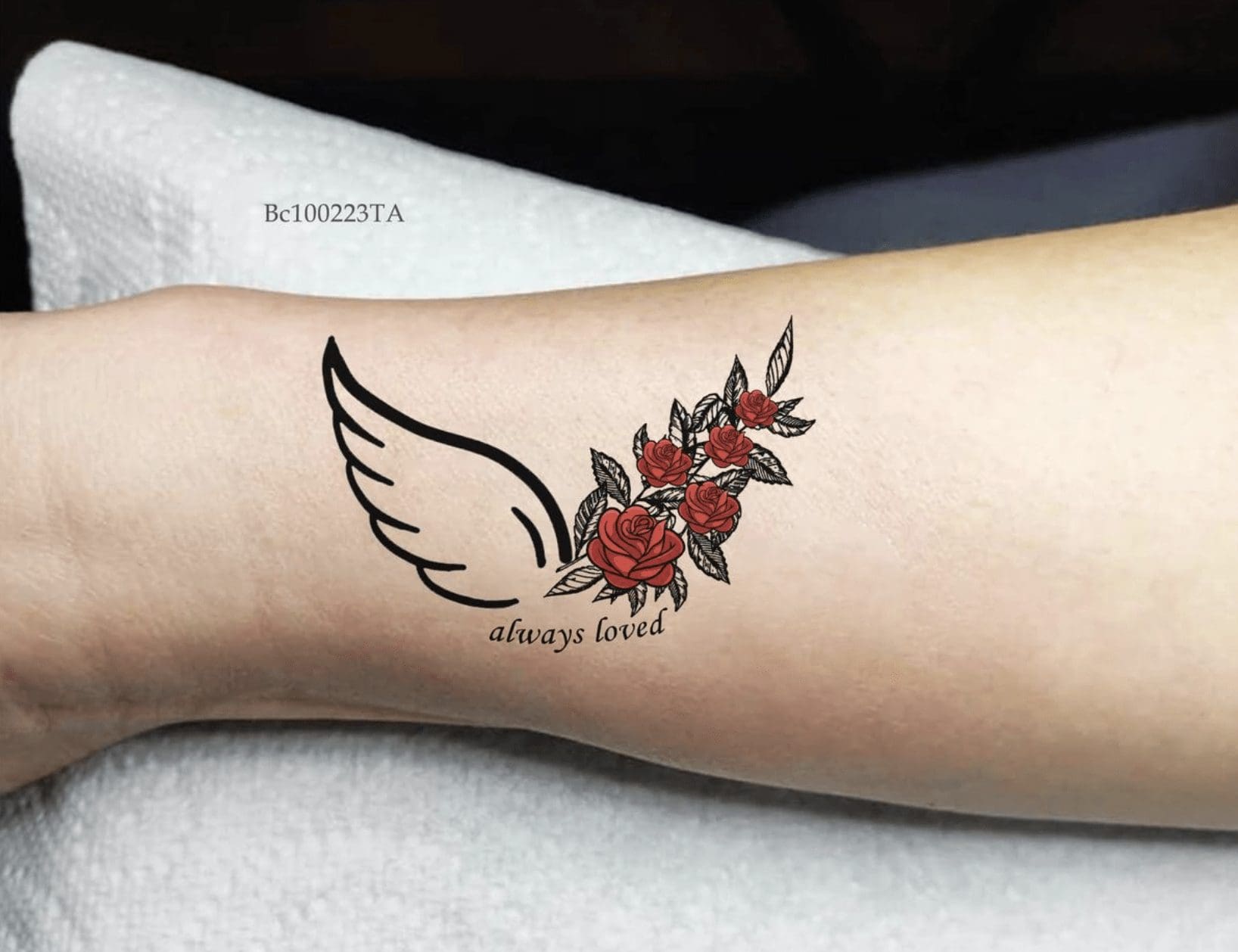 red roses and wing tattoo