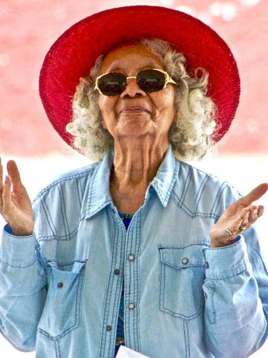 woman wearing red hat and sunglasses