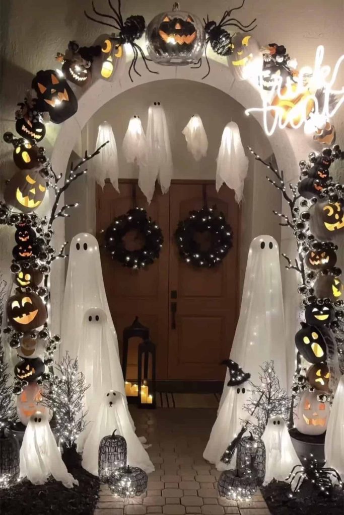 Floating ghosts on an archway at the front of the house