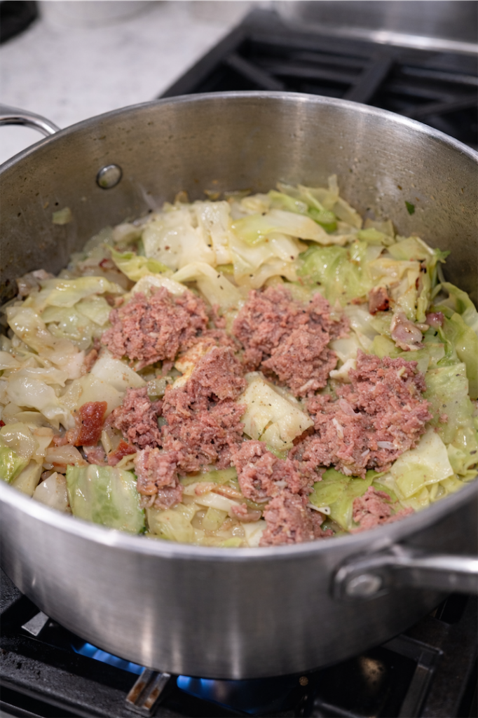 corned beef in saucepan with cabbage
