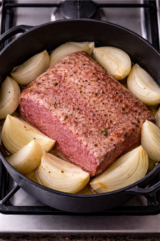 Corned Beef and and onions in black pot