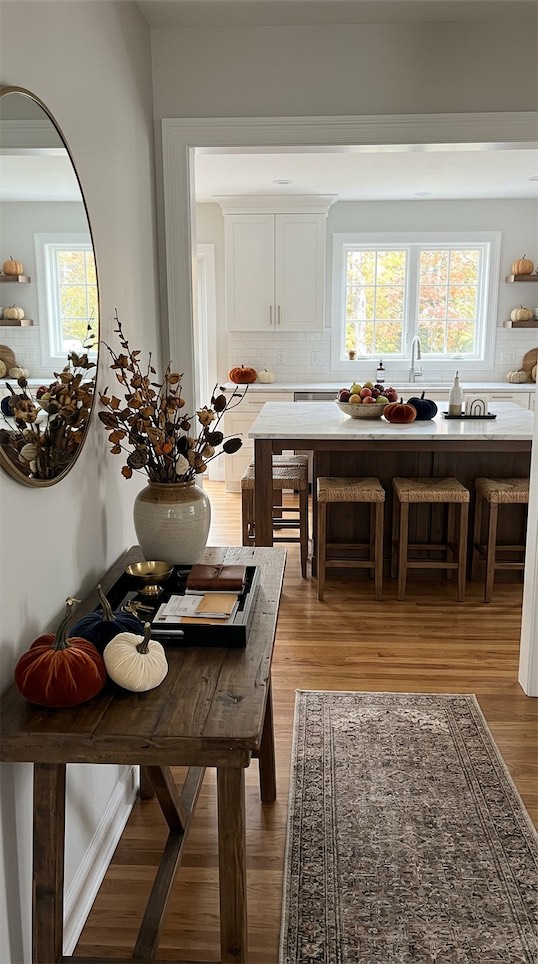 velvet pumpkins on wooden entryway table